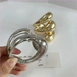 Geometric Spiral Water Droplet Opening Bracelet in Gold Tone